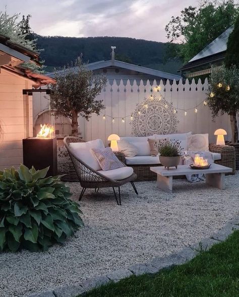 a modern boho patio with wicker seating furniture, a fire pit, a boho chair, some trees, lights and decor Small Garden Waterfalls, Boho Patio, Backyard Inspiration, Outdoor Gardens Design, Backyard Garden Design, Backyard Makeover, Garden Seating, Backyard Patio Designs, Back Garden