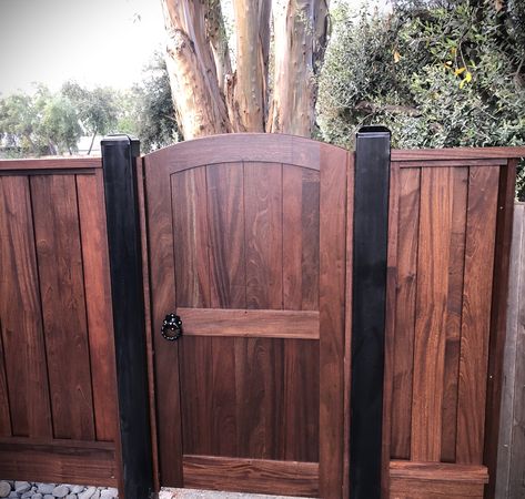 Expertly crafted custom hardwood gates. Handmade from durable and beautiful Mahogany Sapele, in Concord, California. INFORMATION NEEDED: Our Gates are made fully custom and we will need you to take a few measurements for us. (PRICES ARE SUBJECT TO CHANGE WITH DIFFERENT CUSTOMIZATION) Width: Between 32"-48". You will need to measure the width in three places, at the bottom, top, and middle of the space your gate will be installed.  Height: Between 30"-84". This will be the height at the shoulder Hardwood Entryway, Winter Door Hangers, Doors Locks, Wooden Garden Gate, Yard Gate, Garden Gate Design, Metal Gate, Farm Gate, Custom Gates