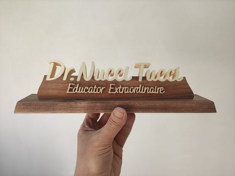 Our product is specially designed and handmade. The wooden table name holder is carefully made from various trees. Personalized table name plate will be the most beautiful decoration of your table with its different and special design. Our products are made of natural wood. In this product, the name parts are made of poplar wood and the pedestal on which the names sit is made of walnut wood. The ground is made of pine or similar trees. Table Name Holders, Natural Wood Desk, Custom Desk Name Plates, Doctor Lawyer, Lawyer Office Decor, Name Holder, Lawyer Office, Doctor Names, Handmade Desks