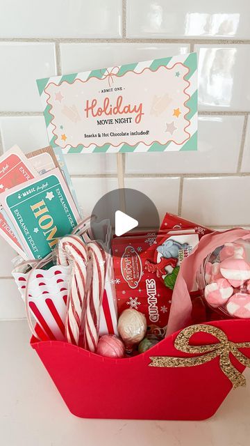 Caitlin Kruse on Instagram: "Dollar Store Holiday Movie Night basket!! I can think of so many people this would be great for: neighbors, teachers with young kids, family friends or even a hostess gift. Your elves could bring it for your kids or you could surprise them with it! Everything was still in stock at my @dollartree this week! The printable holiday movie tickets are in the @themagicplaybook membership site." Christmas Movie Night Basket Ideas, Christmas Movie Gift Basket, Movie Night Basket Ideas, Movie Basket, Movie Night Basket, Movie Night Gift Basket, Holiday Movie Night, Movie Night Gift, Christmas Movie Night