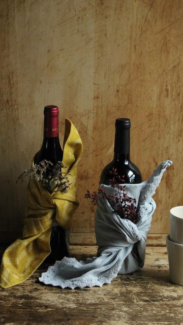 GreenRow on Instagram: "Thoughtful no-waste gift idea for your Thanksgiving host: wrap a bottle of wine in a cloth napkin or tea towel, and finish with a sprig of herbs or dried florals." Wrapping Bottles Gift, Kitchen Towel Wine Bottle Wrap, Tea Towel Wrapped Wine Bottle, Wine Bottle Wrapped In Tea Towel, Wrap Wine Bottle Gift Tissue Paper, Wine Bottle Crafts Wine Wicks & Gifts, Wrap A Bottle, Wine Bottles Gift Wrap, Thanksgiving Host