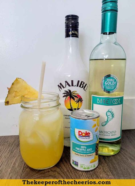 Simple-Pina-Colada-Sangria-3 Simple Pina Colada Sangria, Piña Colada Sangria, Malibu Sangria Recipes, Summer Adult Drinks For A Party, Pins Colada Punch, Simple Drinks With Malibu Rum, Pins Colada Sangria, Pina Colada Sangria Recipe, Make Ahead Drinks Alcohol