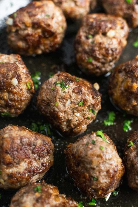 Pan seared bison meatballs are a lean, hearty, and flavorful alternative to traditional beef meatballs. These meatballs require a handful of simple ingredients, like ground bison, egg, garlic, Parmesan cheese, almond meal and Italian herbs, and come together in just 25 minutes from start to finish! Enjoy them as an easy appetizer or load them on with a fresh bowl of pasta marinara. #bisonmeatballs #meatballs #meatballrecipe #bisonrecipe #easydinner #meatballappetizer #appetizer #weeknightdinner Ground Bison Recipes Healthy, Oven Meatballs Recipe, Ground Bison Recipes, Bison Meatballs, Garlic Meatballs, Bison Recipes, Ground Bison, Pasta Marinara, Sundried Tomato Pesto