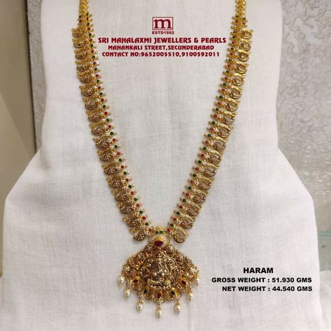 Presenting Here Very Light Weight New Collection Added Antique Finish Long Harams In The Stock Studded with Ruby and emeralds and cz's and South Sea pearls. VISIT OUR SHOWROOM FOR FULL RANGE OF COLLECTION AT WHOLESALE PRICES Please call WHATSAPP VIDEO CALL NO. 9100592011, 9652005510 www.srimahalaxmijewellers.in #SriMahalaxmiJewellers #MahalaxmiJewellers #longharam #haram #tradional #tradionalwear #southindian #southindianwear #bridalwear #partywear #briderjewellery 50 Grams Gold Haram Designs, 50grams Gold Haram, Whatsapp Video Call, Gold Haram Designs, Mango Haram, Haram Designs, Gold Haram, Temple Jewelry Necklace, Long Haram