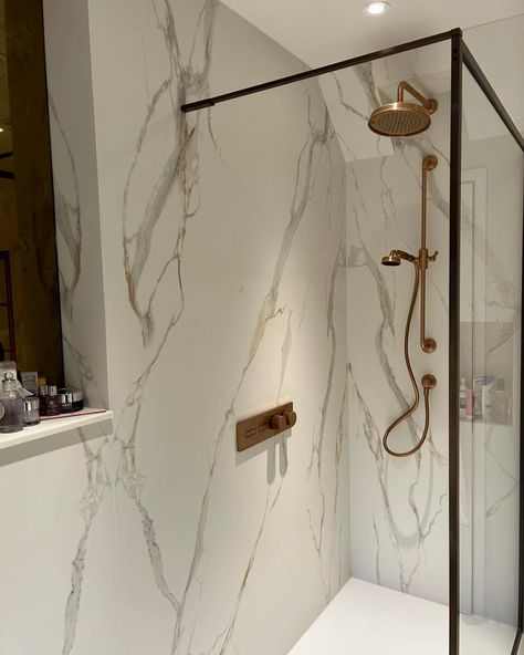 In this en-suite bathroom, you'll find bookmatched sets of our Calacatta Oro, installed by @jjupp_tiling. Thanks for choosing Clay for your project; we love the end result. We're always excited to see your completed projects or installations. Remember to tag us to be featured. Achieve the Aesthetic: Calacatta Oro MB06 Imagery sourced: @jjupp_tiling #clayinternational #calcattaoro #bookmatched #bathroominstallation #bathroomdesign #calacattaoro Calacatta Oro Bathroom, Calcutta Gold Bathroom, Calcutta Gold, Suite Bathroom, Bathroom Installation, Excited To See You, Gold Bathroom, En Suite Bathroom, New Room