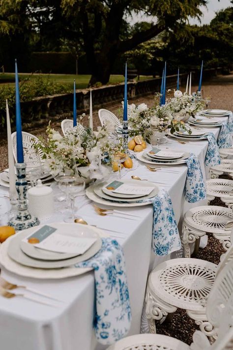 Italian Inspired Wedding Table Decorations with Lemons And A Blue Wedding Theme Blue And Yellow Mediterranean Wedding, Blue And White Table Decorations Party, Blue White And Yellow Table Setting, Blue And White Lemon Theme, Mediterranean Wedding Decor Ideas, Blue White Lemon Tablescape, Mediterranean Blue Wedding Theme, Lemon Blue Wedding, Lemon Italian Wedding