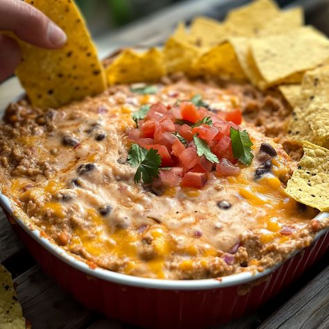 Smoked Taco Dip Smoked Taco Dip, Seasoned Ground Beef, Cheesy Dip, Low Carb Tacos, Crowd Pleasing Appetizers, Taco Dip, Tacos And Burritos, Velveeta Cheese, Pita Chips