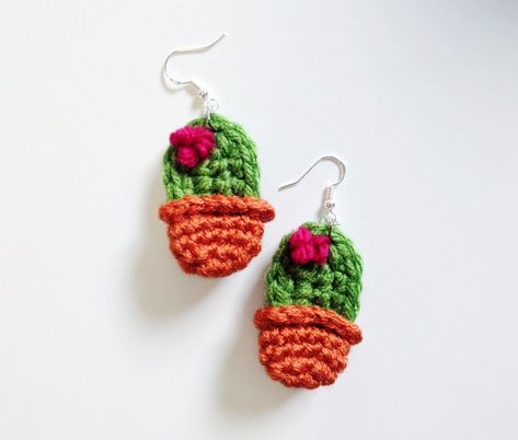 "This is a crochet pattern PDF, not a finished item. Make an adorable pair of cactus earrings with this crochet pattern! These earrings are about 2 inches long. Perfect for when you want to take your plant babies with you on the go! You could wear it as a necklace, too! >> Pattern level: advanced (or ambitious) beginner. Must be comfortable working in the round and changing colors. >> Sizes included: one size, 2 inches long Materials needed: - worsted (weight 4) yarn - 2.75mm hook - Crochet Sloth, Earrings Patterns, Crochet Cactus, Crochet Jewelry Patterns, Crochet Earrings Pattern, Cactus Earrings, A Necklace, Earring Patterns, Easy Crochet Patterns