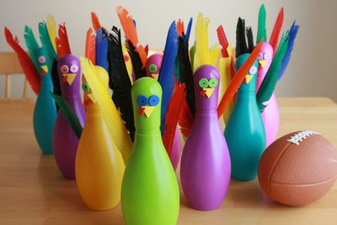 Thanksgiving Turkey Bowl --  Here is an easy to put together Thanksgiving game even the adults will want to get in on! By adding feathers and little faces to a plastic colorful set of bowling pins you create a fun turkey bowling game. A great addition to your Turkey day festivities! Turkey Bowling, Fun Thanksgiving Games, Turkey Crafts Kids, Diy Thanksgiving Crafts, Easy Diy Thanksgiving, Thanksgiving Games For Kids, Thanksgiving Crafts Diy, Easy Thanksgiving Crafts, Thanksgiving Activities For Kids