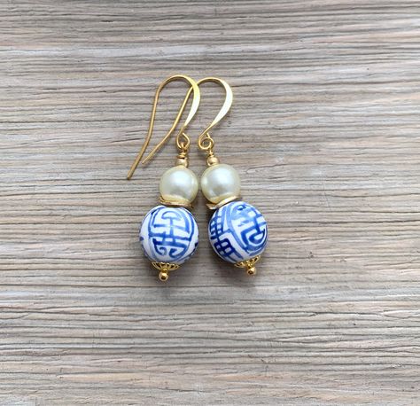 Porcelain blue and white Chinese longevity beads are topped with brushed gold and shell pearl beads and suspended from french hook ear wires.  The details: 12mm porcelain beads - 8mmshell pearl beads - length 1.75 inches. Available in gold and silver metals. Need multiples? I offer a tiered discount for larger orders. Just message me for pricing. Your earrings will arrive in a lovely  gift box with a ribbon, ready for gift-giving. Please see my shop policies on turnaround time and shipping befor Infinite Jewelry, Earrings Preppy, Jar Earrings, Grand Millennial, Porcelain Beads, Porcelain Earrings, White Jewelry Box, Spring Earrings, Porcelain Blue