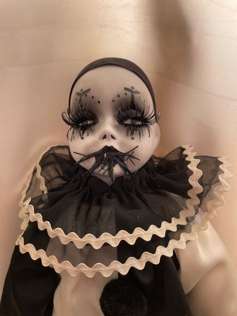 A bat-eating Pierrot Art Doll made from a vintage porcelain doll. This unhappy Clown Doll is one of a pair of clown dolls, but with a more sinister appetite. The doll is for decoration purposes only and comes with a supply of black balloons ready to be inflated. Porcelain Jester Doll, Clown Doll Aesthetic, Pierrot Clown Art, Clown Dolls Vintage, Porcelain Clown Dolls, Bat Eating, Porcelain Dolls Vintage, Vintage Clown Doll, Clown Dolls