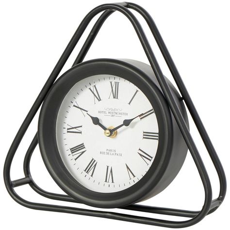 Place this metal clock on a bookshelf or bedside table as a decorative accent piece, or as functional time-keeping device. Requires 1 AA battery, not included. This item ships in 1 carton. Metal clock has a white face with black Roman numerals and black hands. The clock mechanism runs silent. Iron clock makes a great gift for any occasion. Suitable for indoor use only. This item ships fully assembled in one piece. This is a single black colored mantel clock. Modern style. Clock face features the Geometric Clock, White Clocks, Shelf Clock, Black Hands, Metal Clock, Mantel Clocks, Tabletop Clocks, Modern Clock, Clock Decor