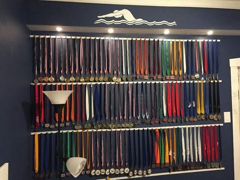 How To Display Gymnastics Medals, How To Display Medals, Swimming Trophies, Gymnastics Medal Display, Swim Ribbons, Swimming Awards, Hanging Medals, Sports Medal Display, Gymnastics Medals