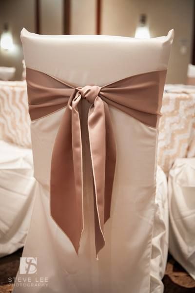 Hilton Houston Westchase - Our latte sashes tied in a classic knot over the ivory square back chair covers Chair Tie Back Ideas, Elegant Party Sash With Bow Tie Back, Wedding Satin Tie Back Sash, White Chair Sash Wedding, Chiffon Wedding Chair Sash, White Chair Sash, Chair Covers Wedding Reception, Couples Chair, White Chair Covers