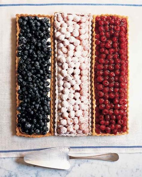 Transform three crème fraîche tarts into a grand old flag by topping them with blueberries, red raspberries, and golden raspberries disguised under a snowy blanket of confectioners sugar. #fourthofjuly #desserts #marthastewart Bastille Day Party, Berry Tarts, Buffet Dessert, Blueberry Chocolate, Martha Stewart Recipes, Berry Tart, Blue Desserts, Raspberry Tarts, French Patisserie