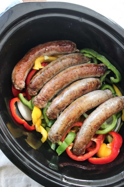 These Slow Cooker Sausages with Peppers and Onions is a no fuss meal with TONS of flavor! Serve with your favorite marinara to make it complete! Sausages And Peppers, Slow Cooker Sausage Recipes, Sausage And Peppers Crockpot, Sausage Crockpot Recipes, Sausage Slow Cooker, Sausage Crockpot, Italian Sausage Recipes, Sausage Dishes, Crock Pot Slow Cooker