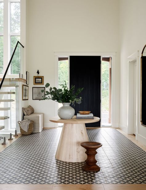 an entryway with a tiled floor section Transitional Foyer, Creating An Entryway, Entryway Flooring, Apartment Entryway, Tiled Floors, Design Blogs, Entryway Ideas, Entry Way Design, Gray Interior