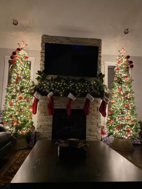 Two Christmas Trees In Living Room By Fireplace, Twin Christmas Trees, Holiday Fireplace Garland, Christmas Tree Fireplace Decor, Christmas Trees On Each Side Of Fireplace, Decorate Sides Of Fireplace, Christmas Trees By Fireplace, Two Christmas Trees By Fireplace, Double Christmas Trees In Living Room