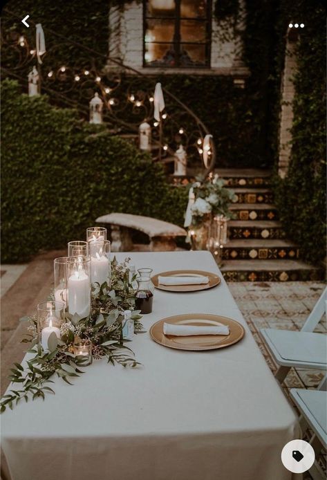 Candlelit Wedding Centerpieces, Sweetheart Table With Greenery Garland, Greens And Candles Centerpieces, Outdoor Wedding Table Ideas, Clear Charger Plates Wedding, Wedding Head Table Candles, Greenery And Candle Centerpiece, Candle And Greenery Centerpiece, Gold Charger Plates Wedding