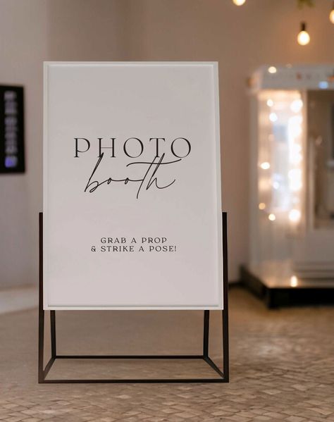 Liven up your wedding reception and encourage silly moments with a fun and inviting "Photo Booth" sign. This eye-catching sign entices guests to visit the photo booth area, letting them know they can capture wacky and memorable pictures throughout the night. Imagine your guests gathered around the photo booth, snapping fun and whimsical photos with props and backdrops. This sign creates a focal point for this interactive entertainment, adding to the lively atmosphere of your reception. "Photo Bo Photo Booth Prop Display Ideas, Wedding Decorations Photo Booth, Photo Booth Signs Wedding, Wedding Photobooth Sign, Whimsical Photos, Photo Booth Alternative, Photobooth Sign, Diy Photo Booth Backdrop, Photo Booth Wedding