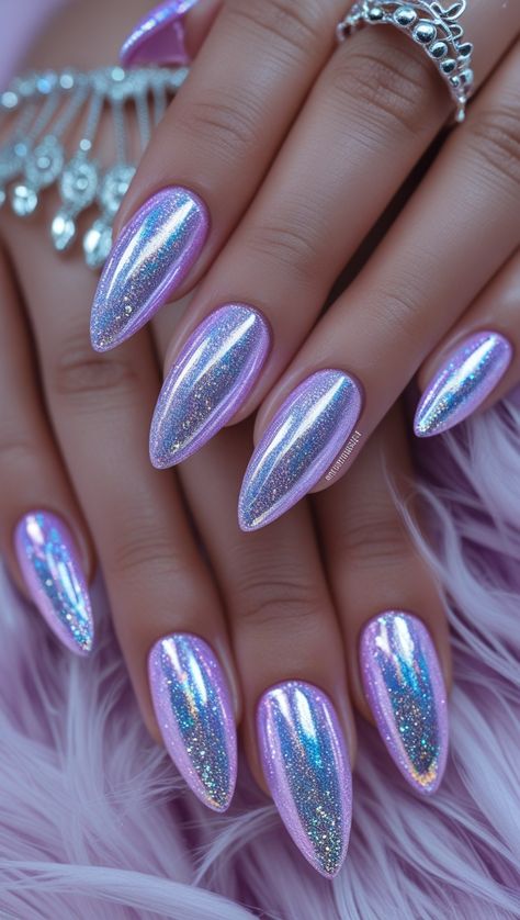 Achieve a dreamy look with pastel purple and pink nails, iridescent accents, and a high-gloss finish, ideal for those who love soft and sparkly designs. Purple Holographic Nails Designs, Lavender Valentines Nails, Holo Nail Art, Holo Nails Designs, Dreamy Nail Art, Light Purple Chrome Nails, Purple Iridescent Nails, Light Purple Nail Ideas, Iridescent Nail Designs