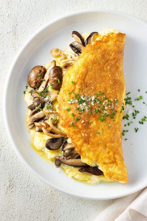 This fluffy Souffle Omelette with Gruyere & Mushrooms is a special breakfast or brunch entree you're going to love! #souffleomeletterecipe #souffleomelette Omelette Recipe, A Glass Of Wine, Boiled Egg, Breakfast Brunch Recipes, Glass Of Wine, Omelet, Egg Recipes, Brunch Recipes, Parmesan