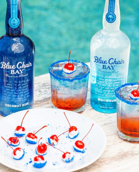 We are ready to celebrate America with a 4th of July cocktail and treat!⁠ This duo is the perfect way to add red, white, and blue to your 4th.   These layered drinks and cherry bombs are easy and delicious!  #bluechairbay #coconutrum #whiterum #cherrbombs Red White Blue Drink, Blue Alcoholic Drinks, Coconut Rum Drinks, Patriotic Drinks, Key Lime Rum Cream, Fourth Of July Drinks, 4th Of July Cocktails, Layered Drinks, Rum Cocktail Recipes