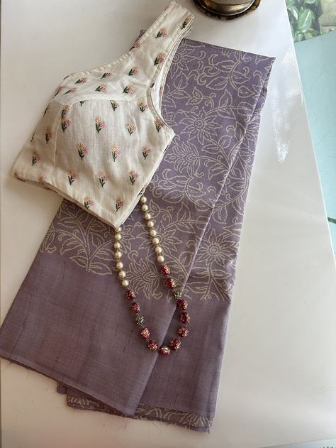 This Veena sees the coming together of an ethereal textile in a sublime colour palette and classy design. A lavendar pure handwoven tussar saree with beige hand block printed florals all of the body and vertical creeper type block prints on the pallu , is as dreamy and sophisticated of a saree that you are going to lay your eyes on. Hand Printed Sarees, Cotton Fabrics Textiles, Block Print Saree Designs, Textile Designing, Pink Blouse Designs, Tussar Saree, Saree Blouse Styles, Cotton Saree Blouse Designs, Sarees For Girls