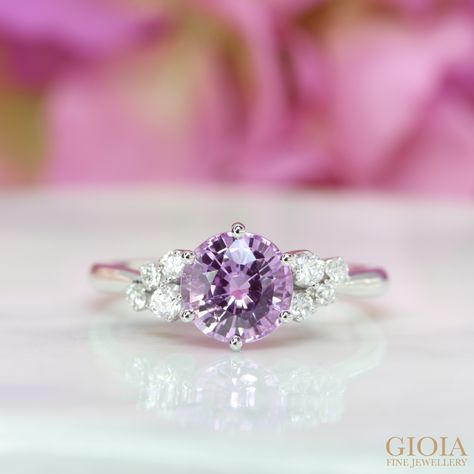 Violet Pink Sapphire Cluster Diamond Ring
Featuring a unique round brilliant violet pink sapphire, designed with side diamonds encrusted together to form this beautiful engagement ring.  
Wishing both a warm engagement and joyful life ahead. Happy engagement! Purple Saffire Engagement Ring, Violet Sapphire Ring, Sapphire Engagement Ring Pink, Amethyst And Diamond Engagement Ring, Violet Engagement Ring, Lavender Engagement Ring, Pink Engagement Rings, Purple Engagement Ring, Purple Sapphire Engagement Ring