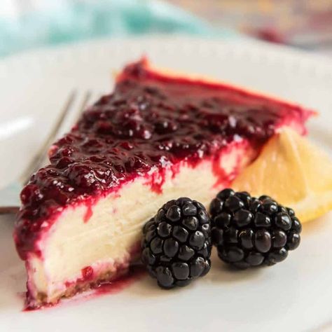 Blackberry Cheesecake is sweet, tart, and creamy all at once! Lemon cheesecake perfectly accents the sweet blackberry sauce for a dessert perfect for any occasion! Blackberry Cheesecake Topping, Blackberry Lemon Cheesecake, Cheesecake With Blackberry Topping, Blackberry Cheesecake Brownies Recipe, Blackberry Cheesecake Galette, Coconut Pie Recipe, Cream Cheese Spread Recipes, Blackberry Sauce, Friendship Bread Recipe