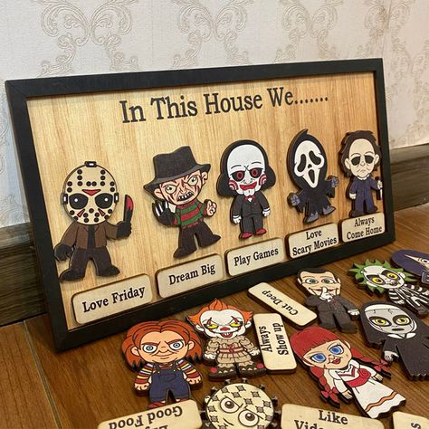 Our "In This House We..." series of custom wooden signs offer a wide variety of fun styles to choose from. Each product features an iconic horror movie character or cartoon horror costume image, perfect for fans of classic horror movies or Halloween horror themed home decoration. It is a unique and fun way to show your love for iconic characters while highlighting the values and activities that your family cherishes. Its detailed design and personalized elements make it a striking piece that reflects your passion and uniqueness. It will be a great gift for family or friends on Halloween, adding a touch of horror and fun to your home! Christmas Family Signs, Family Signs Wooden, House Horror Movie, Horror Movie Design, Halloween Wood Signs, Horror Costume, Personalized Wooden Signs, Custom Wooden Signs, Auntie Gifts