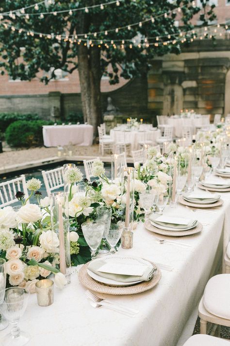 Timeless and elegant wedding tablescpape adorned with white roses and touches of greenery | wedding tablescape, wedding table decor ideas, wedidng tablescapes, table decorations, wedding table decor ideas, wedding reception, wedding reception decorations, wedding reception decor ideas, table settings, wedding flowers, floral centerpieces, flower arrangements, floral inspiration,floral installation, wedding planning, wedding florist,romantic wedding decor, elegant wedding decor,2023 wedding,roses Long Table Arrangements Wedding, Rectangular Table Flower Arrangements, Wedding Decor White And Green, Wedding Reception Table Flowers, Wedding Table Dressing, Centerpieces For Long Tables, Elegant Wedding Florals, White Table Decor, Long Table Flower Arrangements