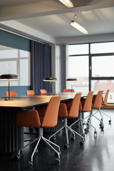 Orange Conference Room, Office Dark Floor, Office With Orange Accents, Dark Floor Office, Blue And Orange Office Design, Office Interior Design Blue, Orange And Blue Office, Blue Conference Room, Blue Office Interior