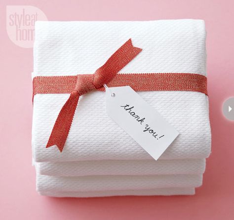 Simple and tasteful, stack bright white folded terry towels together and tie it with a holiday gift wrap accessory like a pretty metallic ribbon. How To Wrap Towels As A Gift, Folding Towels, Home Organization Ideas, Budget Decor, Gifting Ideas, Powder Rooms, Ribbon Wrap, Get Well Gifts, Holiday Gift Wrap