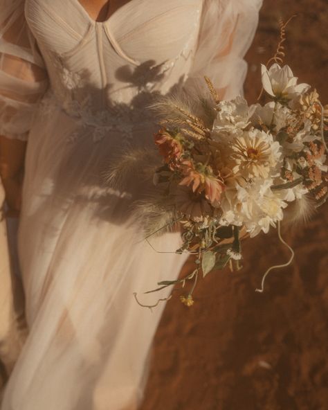 previews from a romantic adventure in the desert Under the untamed skies of Moab Utah, two souls stood on the edge of Canyonlands the day before their wedding, seeing each other for the first time in that golden light. The wind played tricks with their hair, swirling like some wild spirit, as if Mother Nature herself was in on the secret. The following day, they came together, grounded in the red dirt at Red Earth Venue, exchanging vows with nothing but the ancient canyons, their loved on... Natural Light Wedding Photography, Light Wedding Photography, Red Earth, Romantic Adventures, Red Dirt, Light Wedding, Moab Utah, Wild Spirit, Golden Light