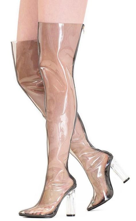 Features a clear upper all the way up to mid-thigh. Back zipper closure. Pointed toe paired with lucite heel. Approximate heel height 4 inches Clear Heel Boots, Clear Chunky Heels, Clear Boots, Thigh High Heels, Lucite Heels, Funky Shoes, Thigh High Boots Heels, Pointed Toe Boots, Jelly Shoes