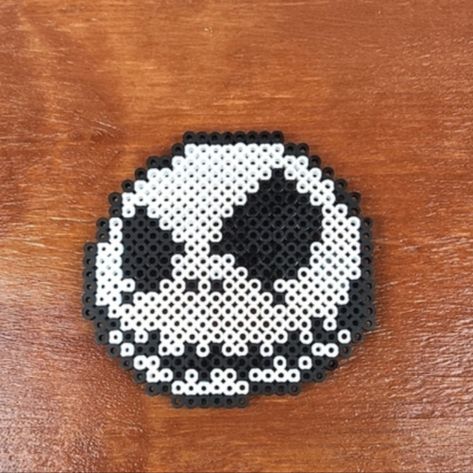 Jack Skellington Nightmare Before Christmas Pixel Art Collectible Magnet Measures Approx. 4 1/4 X 4 1/2" Handmade Perler Art Designed Entirely Out Of Perler Beads This Is A Unique Handmade Item These Make Great Gifts, Collectibles, Wall Art Etc. Can Be Made Into A Keychain If You Prefer Just Message Me Check Out Our Other Items To Make Bundles If You Like Any Items I Will Send An Offer To You Including The Seller Discount Of 10% Off 2 Or More Items Ships Same Or Next Day! Thank You! Thank You! Nightmare Before Christmas Melty Beads, Melted Bead Art, Perler Bead Patterns Horror, Halloween Perler Bead Ideas, Nightmare Before Christmas Pixel, Jack Skellington Perler Beads, Nightmare Before Christmas Pixel Art, Nightmare Before Christmas Perler Beads, Christmas Hama Beads