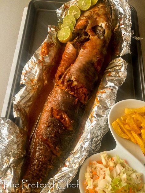 Baked catfish in pepper sauce wrapped in foil popularly called point and kill in Nigeria..catfish pepper soup, spicy grilled catfish...in restaurants Grilled Catfish Recipes Foil, Easy Fufu Recipe, Grilled Catfish Recipes, Catfish Pepper Soup, Baked Fish In Foil, Baked Catfish Recipes, Grilled Catfish, Baked Catfish, Barbecue Fish