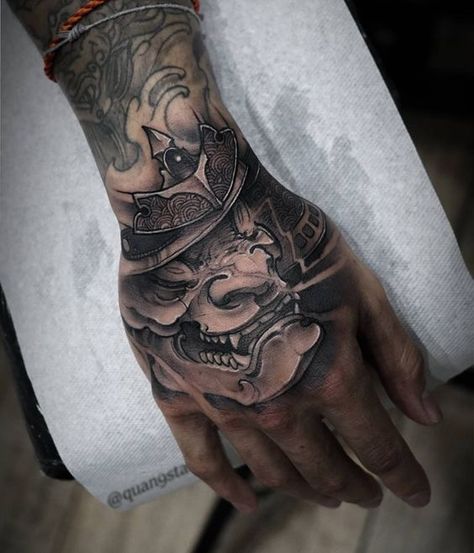 Check out our website for more Tattoo Ideas 👉 positivefox.com #handtattoos #tattooideas Dragon Hand Tattoo, Geometric Tattoo Hand, Samurai Mask Tattoo, Japanese Hand Tattoos, Oni Tattoo, Hannya Mask Tattoo, Skull Hand Tattoo, Tattoo On Hand, Mask Tattoo