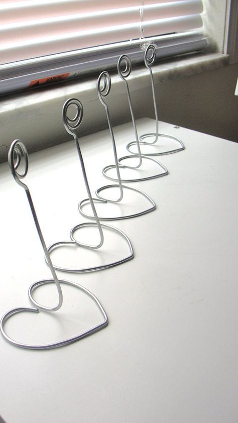 Wedding Table Number Holders, Diy Table Numbers, Wire Jig, Wire Ornaments, Wire Art Sculpture, Table Number Holders, Wire Diy, Silver Table, Wire Sculpture