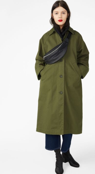 A raglan coat featuring a utility style, a below the knee length, slanted front pockets and a button front closure. Long Coat Style Women, Mid Length Trench Coat Outfit, Green Winter Outfits For Women, Outdoorsy Style Winter, Moss Green Outfit, Monki Coat, Green Trench Coat Outfit, Green Coat Outfit, Raglan Coat