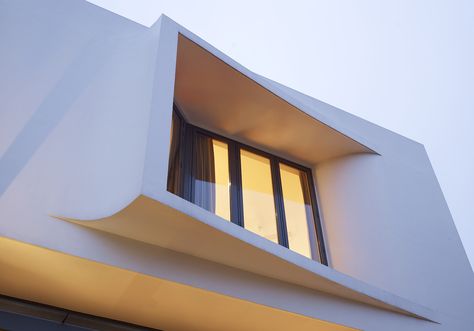 The living, dining and kitchen areas of this two-storey semi-detached house have been designed as one large audiovisual and entertainment space, efficiently soundproofed by double glazed sliding-folding doors. The two sidewalls that flank this space were intentionally built to taper towards the rear. This creates a slightly funnelled space that not only enhances the acoustic … Window Elevation, Hyla Architects, Sliding Folding Doors, Window Detail, Two Storey House, Curved Walls, House Front Design, Window Design, House And Home Magazine