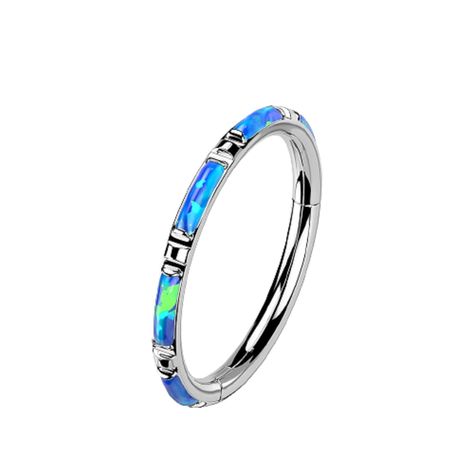 PRICES MAY VARY. STYLE: Rectangular Synthetic Opal Inlaid Hinged Segment Ring MATERIAL: F136 impant grade titanium and synthetic opals GAUGE/BAR THICKNESS: 16GA (1.2mm) DIAMETER LENGTH: 3/8" (10mm) Dermal Piercing Jewelry, Nose Septum, Dermal Piercing, Ring Opal, Body Jewelry Piercing, Synthetic Opal, Cartilage Piercing, Blue Rings, Hoop Ring