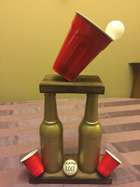 Beer pong trophy that I made for my White Trash Birthday Bash Beer Pong Trophy Diy, Drunk Olympics Games, Beer Olympics Trophy, Diy Trophy Ideas, Drunk Olympics, Beer Pong Trophy, Beer Olympics Party, Beer Pong Party, Trailer Trash Party