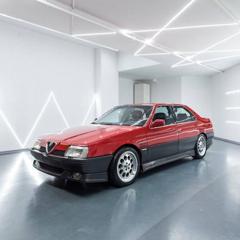 A downright awesome one:  This 1990 Alfa Romeo 164 3.0 V6 Quadrifoglio is up for auction with Auctomobile until the 1st of July. The sought-after modern classic is equipped with a 3.0 liter Busso V6 engine with manual transmission, producing 200hp. The limousine is finished in a two-tone combination of Rosso Alfa & Grigio Scuro and features a black leather interior!  Like&subscribe for more fantastic modern classics! Alfa 164, Alfa Romeo 164, Alfa Romeo 1750, Alfa Romeo Stelvio Quadrifoglio, Alfa Romeo Spider, Alfa Romeo Gtv, Alfa Romeo Giulietta Spider 1956, Alfa Romeo Cars, Bugatti Cars