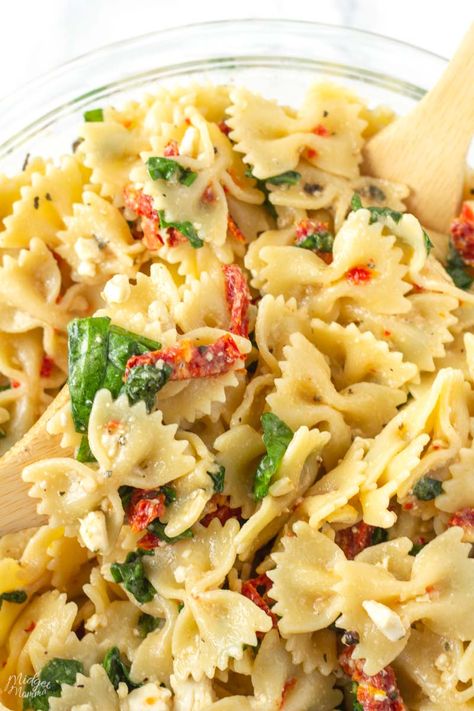 A bowtie pasta salad with spinach, feta cheese and sun dried tomatoes that come together with Italian dressing giving this summer side dish recipe amazing flavor! Sun Dried Tomato Feta Pasta, Pasta Salad Recipes Bowtie, Bowtie Pasta Recipes Salad, Bow Tie Pasta Salad Recipes, Sundried Tomato Pasta Salad, Bow Tie Pasta Salad, Summer Side Dishes Recipes, Pasta Salad With Spinach, Bowtie Pasta Salad