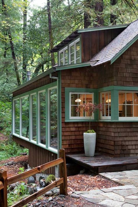 Above a babbling creek, a vintage weekend cabin in northern California got modernized without sacrificing period details. How? Sonoma-based architect Amy Alper, a member of the Remodelista Architect and Designer Directory, essentially wrapped the old building in a new, light-filled shell to take advantage of the Calistoga property’s spectacular views: Planning a rustic weekend getaway? … Forest Window, Exterior Siding Colors, Wood Siding Exterior, Trendy House, Wooden Cabin, House Lake, Cabin Exterior, Window Ideas, Cabin In The Woods