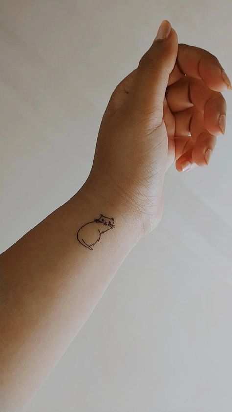 Simple outline of a cat tattoo. Minimalist. Wrist tattoo. #tattoo #cat #simple #outline #minimalist #aesthetic #writstattoo #wrist #cute #cat Minimalistic Wrist Tattoo, Cat Tattoo Minimalist, Minimalist Wrist Tattoo, Cat Line Tattoo, A Cat Tattoo, Simple Cat Tattoo, Cat Simple, Cat Tattoo Simple, Tattoo Minimalist