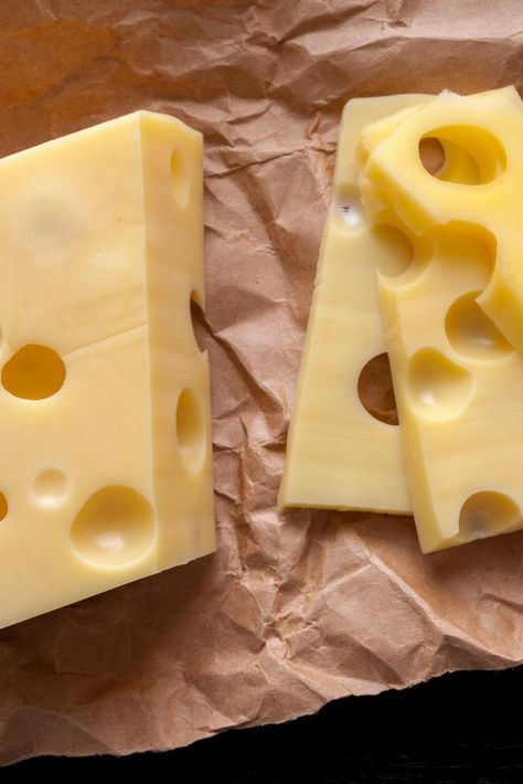 Many people eat sliced Swiss cheese on their sandwiches and melted on burgers, but how much do you really know about this delicious dairy food? Swiss cheese isn’t just a single type of cheese at all. Rather, Swiss cheese is an entire category of cheeses including varieties like Emmental and Appenzeller. The original Swiss that most others are compared to is Emmental, a cheese from abroad that Americans really should try. Swiss cheeses are all of medium-hard texture and have one thing in common: Swiss Cheese Recipes, Low Sodium Cheese, Cheese Recipes Homemade, Cheddar Cheese Recipes, Cheese Making Recipes, Queso Cheddar, Cheese Dishes, Cheese Shop, Monterey Jack