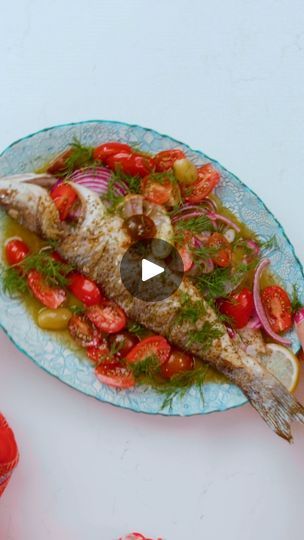 Greek-Style Roasted Branzino Recipe | Greek-Style Roasted Branzino Recipe | By The Mediterranean Dish | - Whole roasted branzino topped with Greek ladolemono sauce. This is an impressive
fish worthy of company, but so easy to make. Let me show you how. (cheerful music) We're working with a whole fish that actually has been scaled and cleaned at your given grocery store. They can do this for you and
it saves a whole lot of time. And we're just gonna go ahead and cut a couple slits
on each side of the fish. Next, we're just gonna give
the fish a simple seasoning of a lots of kosher salt and black pepper, going into the slits that you created, going in the cavity part. Turn over. Season well on this side as well. We're gonna set this aside for a moment and we're gonna work on a couple of thin Ladolemono Sauce, Roasted Branzino Recipe, Roasted Branzino, Branzino Recipe, Whole Fish Recipes, Whole Fish, The Slits, The Mediterranean Dish, Mediterranean Dishes